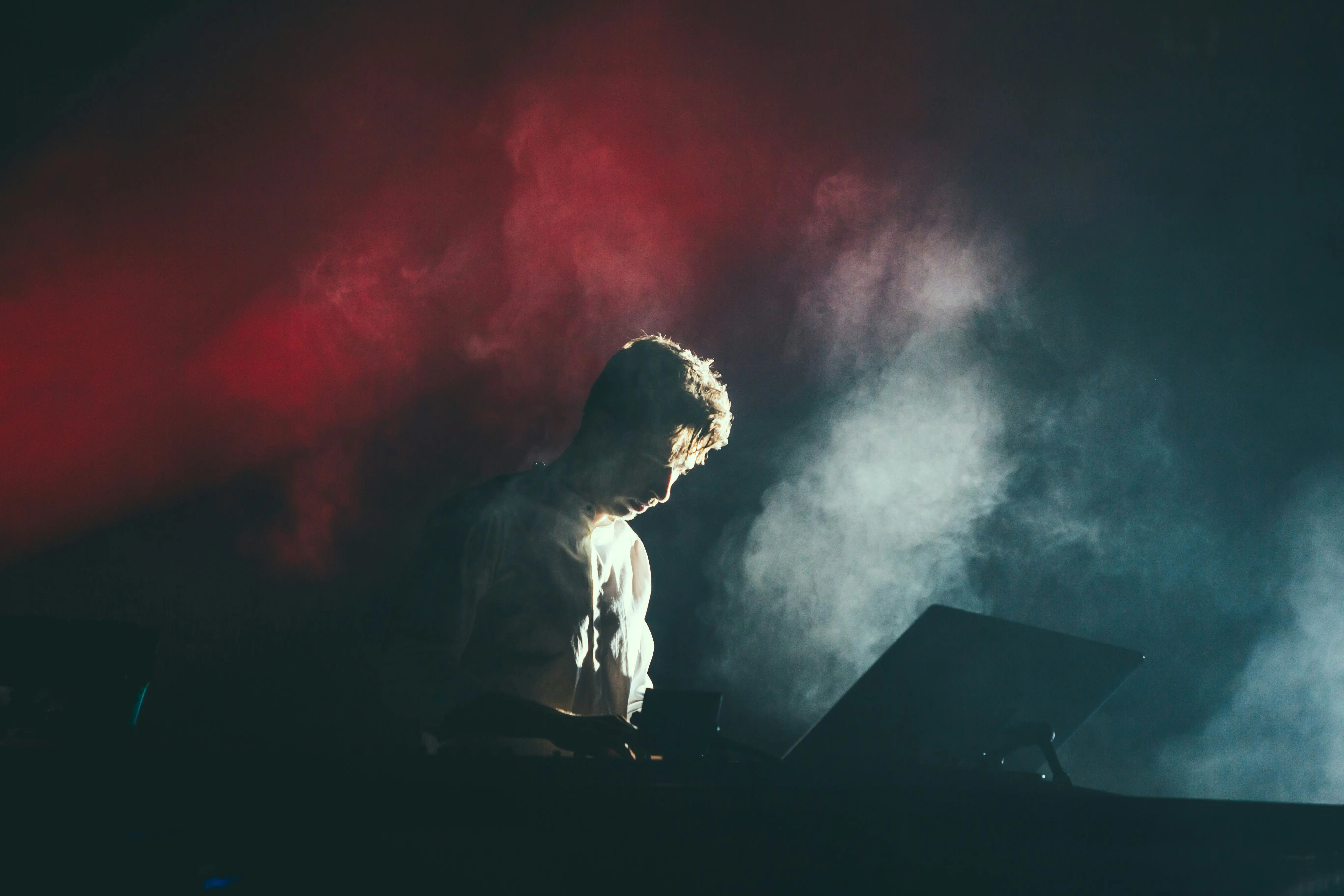 A DJ that can be seen through Smoke Made by Smoke Machines you can find on Gecko” style=