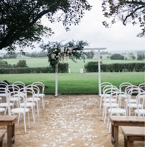 An image of a wedding venue with chairs.